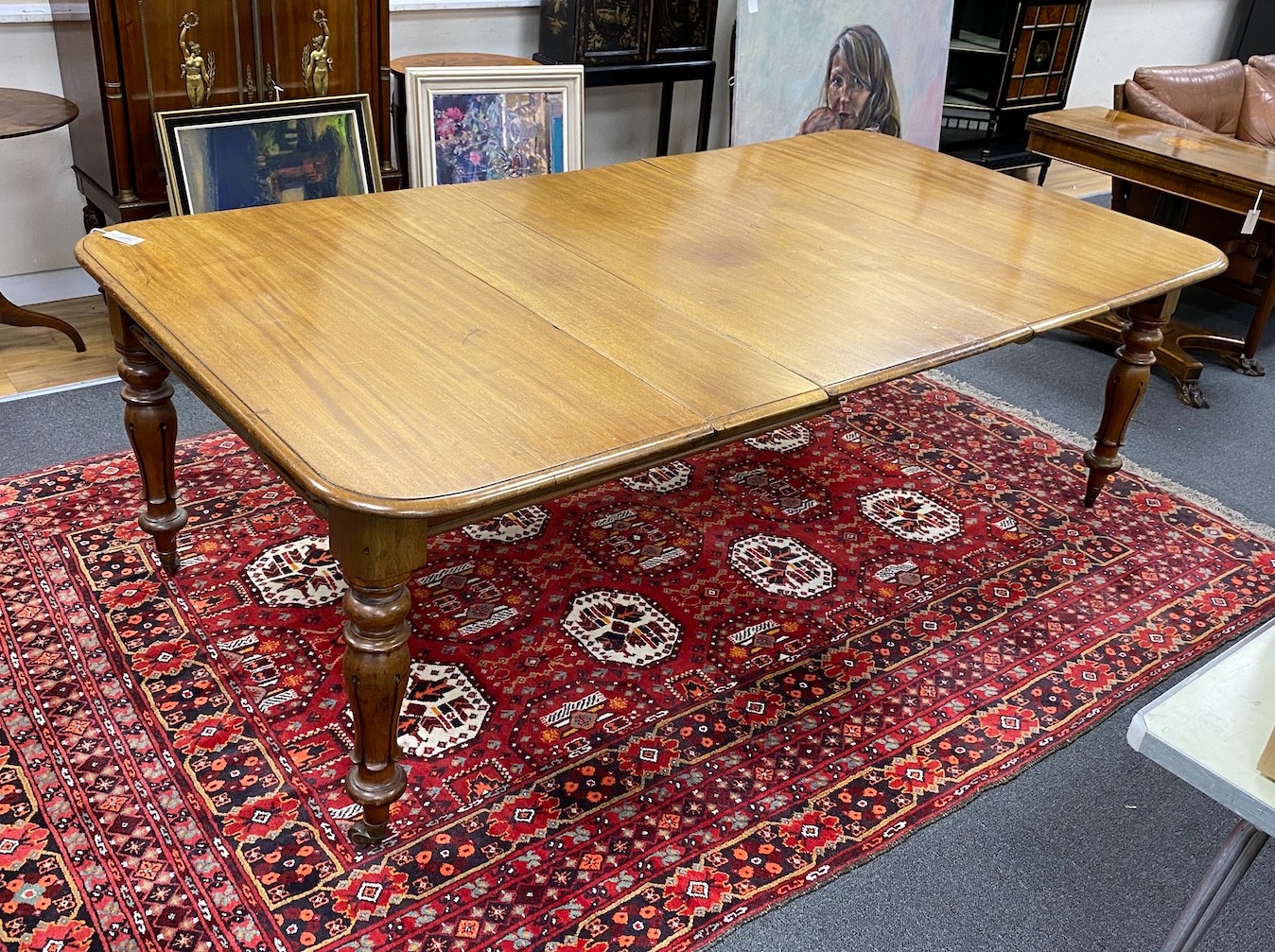 An early Victorian mahogany rectangular extending dining table, length 220cm extended, three spare leaves, width 120cm, height 73cm